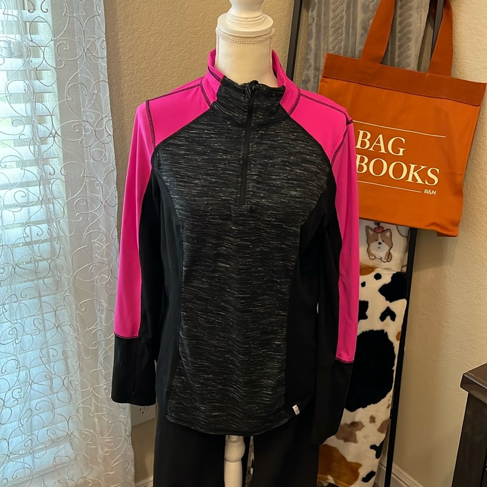 Very lightweight fleece 1/4 pullover. Pink sleeves and black sides.